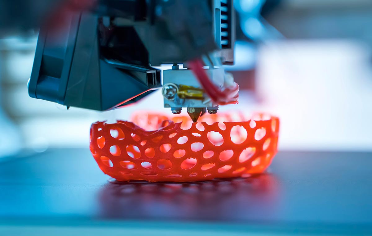 3D printing in progress, showing a layer-by-layer printed part